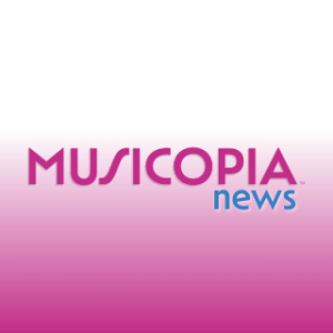 The Musicopia News logo featuring Musicopia in fuchsia with the word News in blue against a gradient background with white at the top that fades into pink and then fuchsia